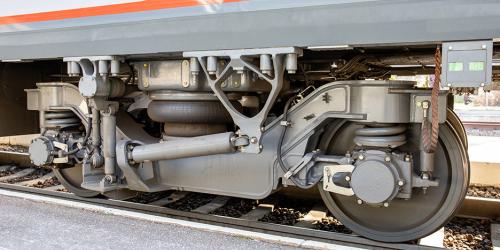 Train wheel and truck with dampening system